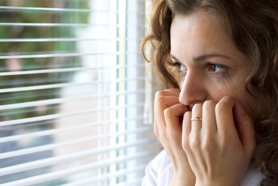 A person hesitating at a crossroads